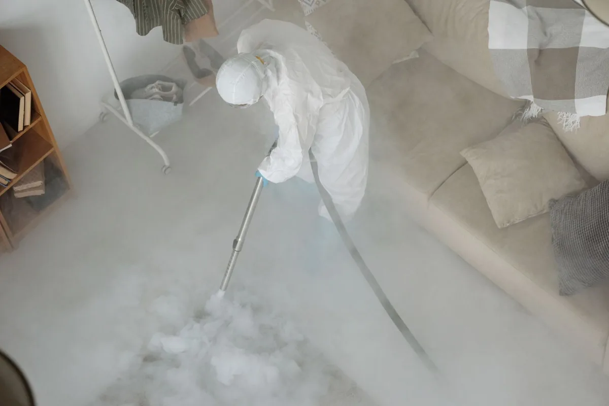 Biohazard cleanup technician in protective equipment, Gulf Shores, AL